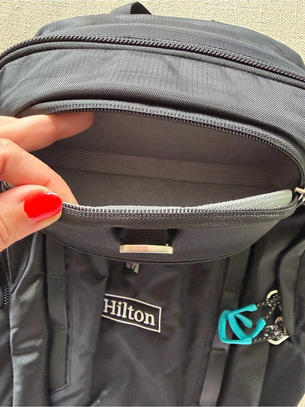 Thule Black Backpack with Aqua Zipper Pulls - Hilton Logo